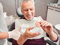 Dentist in Jonesboro, talking to patient about dentures