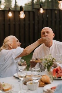 Older couple enjoying a meal outdoors
