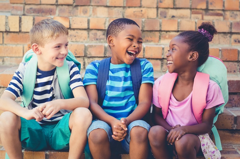 Children smiling at school without dental emergencies